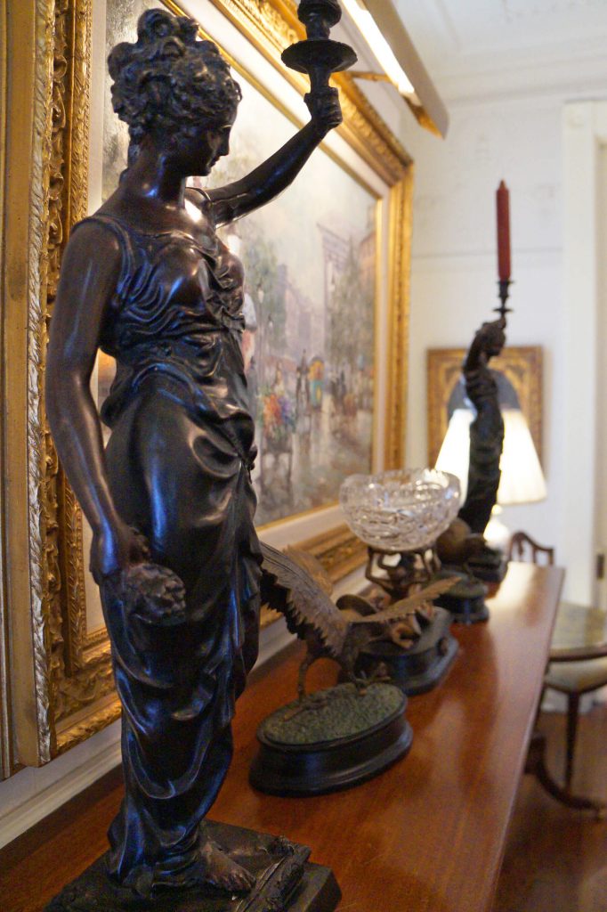 Decorative statues on the parlor mantle